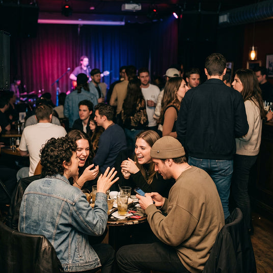 Guests at a listening party straining to hear an album over venue speaker noise and chatter