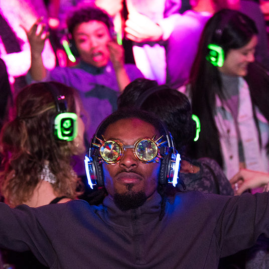 Quiet Events Silent Disco headphones for run walks.  Various participants having fun wearing headphones.